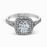 This eye-catching contemporary white gold engagement ring and wedding band set features an impressive halo accented by .63 ctw round cut white diamonds.