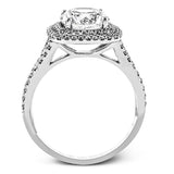 This remarkable white gold engagement ring and wedding band set features a contemporary setting with an eye-catching halo highlighted by .67 ctw of round cut white diamonds.
