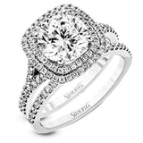 This remarkable white gold engagement ring and wedding band set features a contemporary setting with an eye-catching halo highlighted by .67 ctw of round cut white diamonds.