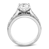 This impressive modern white gold ring features .18 ctw of glimmering round cut white diamonds accentuated by .97 ctw princess cut diamonds.