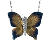 This stunning contemporary butterfly pendant features a stunning .10 ctw white diamond encrusted body to create an incredibly realistic design.
