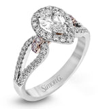 Featuring a lovely pear-shaped halo, this contemporary white and rose gold engagement setting is complemented by a split shank design containing .45 ctw round cut white diamonds and .08 ctw pink diamonds.