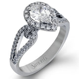 Featuring a lovely pear-shaped halo, this contemporary white and rose gold engagement setting is complemented by a split shank design containing .45 ctw round cut white diamonds and .08 ctw pink diamonds.