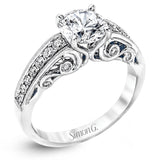 Presenting a purely romantic setting, this remarkable white gold engagement ring is set with .41 ctw of glimmering round cut white diamonds.