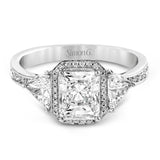 This dazzling contemporary white gold ring showcases a romantic setting featuring a remarkable halo and .19 ctw of round cut white diamonds accented by .68 ctw trillion diamonds.