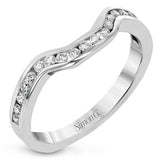 This dazzling contemporary white gold ring showcases a romantic setting featuring a remarkable halo and .19 ctw of round cut white diamonds accented by .68 ctw trillion diamonds.