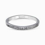 Showcasing a dazzling halo, this contemporary white gold wedding set is highlighted by .45 ctw of arresting round cut white diamonds.