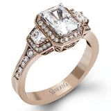 Featuring a lovely romantic setting, this white gold contemporary ring features an exquisite halo and .33 ctw of shimmering round cut white diamonds complemented by .34 ctw of trapezoid side diamonds.