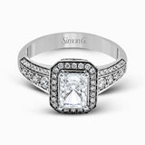 This romantic white gold engagement ring is complemented by .57 ctw of sparkling round cut white diamonds in a vintage-inspired setting.