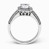 This romantic white gold engagement ring is complemented by .57 ctw of sparkling round cut white diamonds in a vintage-inspired setting.