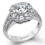 This stunning bridal ring design has a unique geometric halo set with your choice of stunning diamonds or 1.03 ctw of beautiful blue sapphires. The rest of the ring contains .52 ctw of white diamonds.