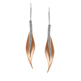 The leaf-like design on these modern earrings was inspired by nature. They contain .13 ctw of scintillating white diamonds.