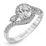 The charming floral design of this contemporary white gold ring is enhanced by .28 ctw of round cut white diamonds and .07 ctw of marquise cut white diamonds.
