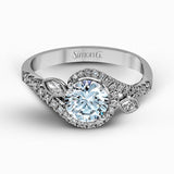 The charming floral design of this contemporary white gold ring is enhanced by .28 ctw of round cut white diamonds and .07 ctw of marquise cut white diamonds.