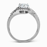 The charming floral design of this contemporary white gold ring is enhanced by .28 ctw of round cut white diamonds and .07 ctw of marquise cut white diamonds.
