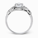 This lovely modern white gold engagement ring features a memorable halo and is accentuated by .19 ctw glistening round cut white diamonds.