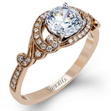 This lovely modern white gold engagement ring features a memorable halo and is accentuated by .19 ctw glistening round cut white diamonds.