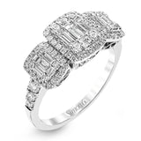 This amazing vintage-inspired ring features three halos and contains .52 ctw of round brilliant diamonds and .41 ctw of baguette diamonds.