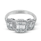 This amazing vintage-inspired ring features three halos and contains .52 ctw of round brilliant diamonds and .41 ctw of baguette diamonds.