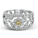 The delicate floral design of this white and yellow gold band is complemented by .53 ctw of round cut white diamonds and .04 ctw of round cut yellow diamond accents.