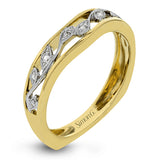 Set with delicate floral patterns, this classic white gold engagement ring is highlighted with .12 ctw round cut white diamonds.