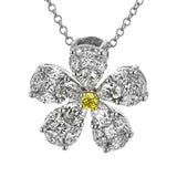 The elegant floral design of this white gold pendant is accentuated by a five petal design with .15 ctw of princess cut diamonds, .48 ctw pear shaped diamonds and .42 ctw marquise cut diamonds.