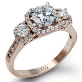 This dramatic contemporary white gold ring is accentuated by .37 ctw round cut white diamonds and features .30 ctw glimmering side stones.