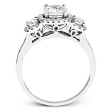 This dramatic contemporary white gold ring is accentuated by .37 ctw round cut white diamonds and features .30 ctw glimmering side stones.