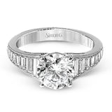 Baguette diamonds increasing in size lead the way to the center of this gorgeous engagement ring design. The outside edge is decorated with delicate milgrain, and this ring contains .98 ctw of side diamonds.