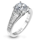 Baguette diamonds increasing in size lead the way to the center of this gorgeous engagement ring design. The outside edge is decorated with delicate milgrain, and this ring contains .98 ctw of side diamonds.