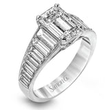 Presenting a thoroughly modern design, this impressive white gold engagement ring features 1.64 ctw of sparkling white baguette cut diamonds.