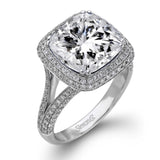 This eye-catching white gold ring is set with a remarkable 5.34 ctw sapphire accentuated by .68 ctw glistening round cut white diamonds.