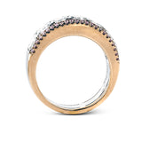 Featuring an eye-catching design, this white and rose gold band is highlighted by .28 ctw of round cut white diamonds and 2.83 ctw of Asscher cut diamonds.