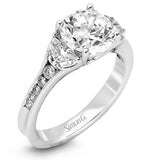 This classically designed white gold ring is emphasized by .18 ctw of white diamonds and .51 half moon shaped diamonds to create a memorable setting.