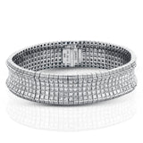 This dazzling contemporary white gold bracelet is set with 1.15 ctw of glistening round white diamonds and 19.48 ctw of princess cut diamonds.