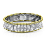 This dazzling contemporary white gold bracelet is set with 1.15 ctw of glistening round white diamonds and 19.48 ctw of princess cut diamonds.