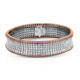 This dazzling contemporary white gold bracelet is set with 1.15 ctw of glistening round white diamonds and 19.48 ctw of princess cut diamonds.