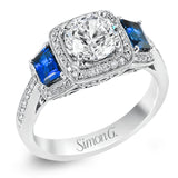 Featuring an elegant classic design, this white gold engagement ring is set with .23 ctw round cut white diamonds and side accents of .62 ctw trapezoid cut sapphires.
