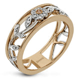 This impressive white and rose gold band is highlighted by a vintage style floral design inset with .09 ctw round cut white diamonds and .01 ctw round cut pink diamonds.