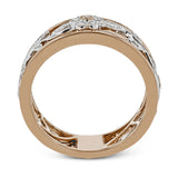 This impressive white and rose gold band is highlighted by a vintage style floral design inset with .09 ctw round cut white diamonds and .01 ctw round cut pink diamonds.