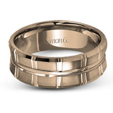 Two wide rows of sleek yellow gold are married with an elegant center cable of striking white gold in this arresting men's wedding band.