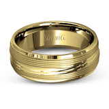 A contemporary ribbed design in lustrous white gold is outlined with two exquisite yellow gold bands in this striking men's wedding band.