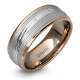 A contemporary ribbed design in lustrous white gold is outlined with two exquisite yellow gold bands in this striking men's wedding band.