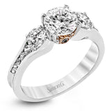 The classic design of this white gold engagement ring is highlighted by .20 ctw of round cut white diamonds and accentuated by .48 ctw of round cut white side diamonds.