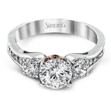 The classic design of this white gold engagement ring is highlighted by .20 ctw of round cut white diamonds and accentuated by .48 ctw of round cut white side diamonds.