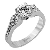 The classic design of this white gold engagement ring is highlighted by .20 ctw of round cut white diamonds and accentuated by .48 ctw of round cut white side diamonds.