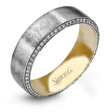 The classic design of this two-tone band features a hint of modernism with a yellow gold interior and white gold exterior accentuated by .50 ctw round cut white diamonds.