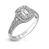This show-stopping white gold ring features intricately detailed halo and sides containing a total of .61 ctw in round white diamonds.