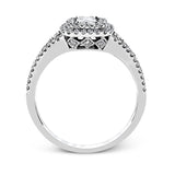 This show-stopping white gold ring features intricately detailed halo and sides containing a total of .61 ctw in round white diamonds.