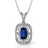 A delicate lacy design surrounds a dazzling 1.22 ctw sapphire and .26 ctw round cut white diamonds in this vintage-inspired white gold pendant.